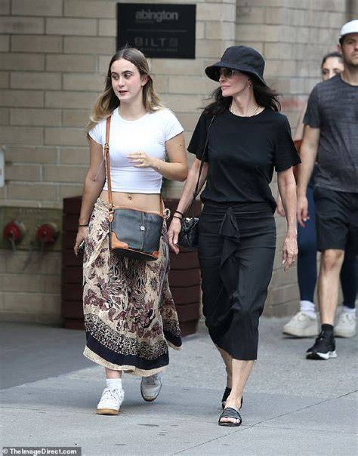 Mama bear:&nbsp;The Scream star paired the dress with a black straw hat, black slides and a small black handbag