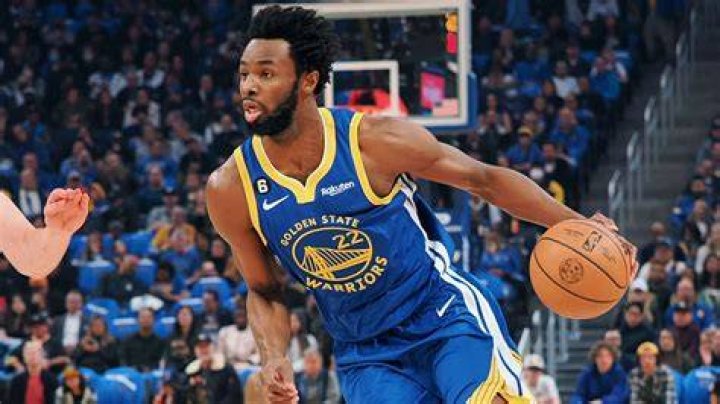 Who is Andrew Wiggins' wife, Mychal Johnson, and what does she do for a